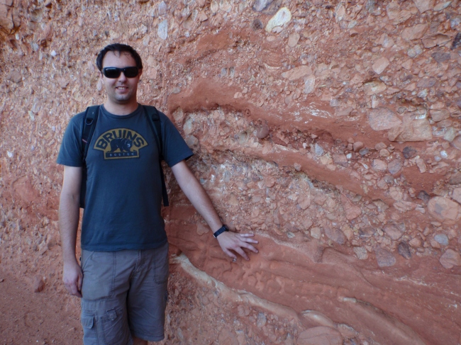 Conglomerate texture, with husband for scale. 