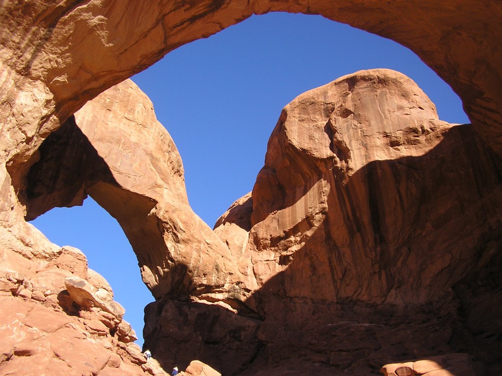 A delightful juxtaposition of rock arches and blue sky, Arches National Park, Utah, Fall 2005.  