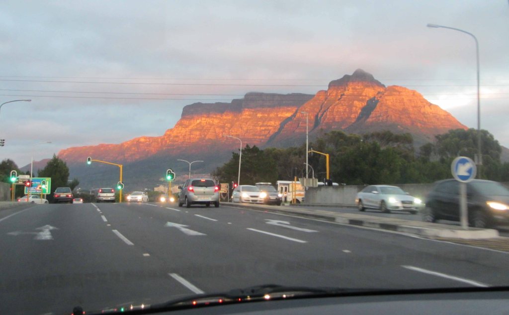A sunlight stripe falls on Table Mountain one morning in Cape Town. 