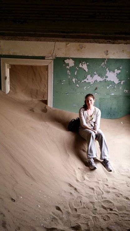 Kolmanskop #1. Sitting on some sand in one of the abandoned houses. 