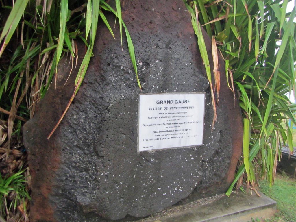 Grand Gaube sign on a large boulder of vesicular basalt, northern Mauritius. 