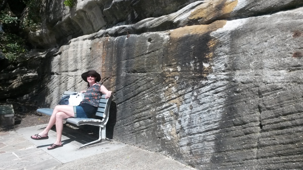 Enjoying a stop at a bench in front of some Sydney sandstone with classic cross-bedding. 